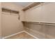 Walk-in closet with carpet flooring and neutral paint color, offering practical storage solutions at 21136 N 36Th Pl, Phoenix, AZ 85050