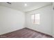 Simple bedroom with neutral carpet, a window, and neutral paint at 22012 E Wayward Ln, Red Rock, AZ 85145