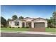 Beautiful single-story home with a well manicured lawn, desert landscaping, and a two car garage at 23098 E Nightingale Rd, Queen Creek, AZ 85142