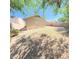Backyard of a tan home with gravel covering and privacy fence at 23771 W Yavapai St, Buckeye, AZ 85326