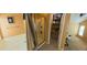 Bright bathroom featuring a soaking tub, glass-enclosed shower, and an adjacent walk-in closet at 23771 W Yavapai St, Buckeye, AZ 85326