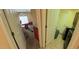 Bedroom leading to laundry room at 23771 W Yavapai St, Buckeye, AZ 85326