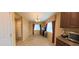 Bright dining room with tile floors, curtains, and a chandelier at 23771 W Yavapai St, Buckeye, AZ 85326
