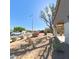 Well maintained front yard with desert landscaping and flowers at 23771 W Yavapai St, Buckeye, AZ 85326