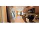 Kitchen with stainless steel appliances and dark wooden cabinetry at 23771 W Yavapai St, Buckeye, AZ 85326