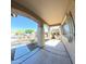 Covered front porch with stone columns and view of the neighborhood at 23771 W Yavapai St, Buckeye, AZ 85326