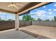 View of a covered patio and block wall in backyard at 2410 S 124Th Dr, Avondale, AZ 85323