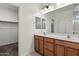 Bathroom features a double sink vanity and large mirror at 2410 S 124Th Dr, Avondale, AZ 85323