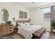 Bedroom featuring a bed, dresser, and bench at 2410 S 124Th Dr, Avondale, AZ 85323