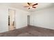 Spacious bedroom featuring a ceiling fan and neutral carpet at 2410 S 124Th Dr, Avondale, AZ 85323