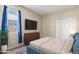 Bedroom with a window, dresser and closet at 2410 S 124Th Dr, Avondale, AZ 85323