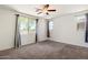 Sun-filled bedroom with ceiling fan, neutral carpet, and great natural light at 2410 S 124Th Dr, Avondale, AZ 85323