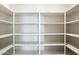 Walk-in closet with ample shelving for optimal storage and organization at 2410 S 124Th Dr, Avondale, AZ 85323