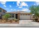 Charming single-story home with desert landscaping, tile roof and a two-car garage at 2410 S 124Th Dr, Avondale, AZ 85323