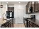 This spacious kitchen features granite counters, subway backsplash and stainless steel appliances at 2410 S 124Th Dr, Avondale, AZ 85323