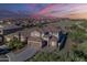 Beautiful two-story home in a well-planned community with mountain views and a colorful sunset at 25155 N 108Th Ave, Peoria, AZ 85383