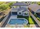 Relax in this backyard oasis featuring a sparkling pool, putting green, covered patio and plenty of room for entertaining at 25155 N 108Th Ave, Peoria, AZ 85383