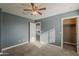 Cozy bedroom with soft carpet and ample closet space at 25155 N 108Th Ave, Peoria, AZ 85383