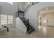 Grand foyer with staircase, tiled floor, and soaring ceiling at 25155 N 108Th Ave, Peoria, AZ 85383