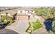 Beautiful two-story home featuring a well-manicured lawn and a two car garage in a desirable neighborhood at 25155 N 108Th Ave, Peoria, AZ 85383