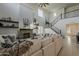 Bright living room features a fireplace, staircase, high ceilings and neutral-toned furniture at 25155 N 108Th Ave, Peoria, AZ 85383