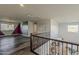 Open loft area overlooking below with unique wall art and natural light at 25155 N 108Th Ave, Peoria, AZ 85383