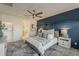 Comfortable bedroom with a padded headboard, stylish lighting, and cozy, decorative pillows at 25155 N 108Th Ave, Peoria, AZ 85383