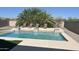 Backyard oasis featuring a sparkling pool with a sun deck and comfortable lounge chairs at 25155 N 108Th Ave, Peoria, AZ 85383