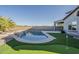 Backyard featuring pool, putting green, lounge chairs and partial view of home at 25155 N 108Th Ave, Peoria, AZ 85383