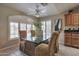 Eat-in dining area with plenty of natural light coming in through large windows with white shutters at 2984 N 152Nd Dr, Goodyear, AZ 85395