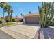 Well-maintained single-story home featuring low maintenance landscaping, desert plants, and a two-car garage at 2984 N 152Nd Dr, Goodyear, AZ 85395