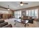 Bright living room featuring plantation shutters and comfortable seating at 2984 N 152Nd Dr, Goodyear, AZ 85395