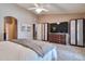Bright main bedroom boasts carpet, ceiling fan, and closet space at 2984 N 152Nd Dr, Goodyear, AZ 85395