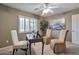 Bright home office with neutral carpet, plantation shutters, a ceiling fan, and comfortable guest chairs at 2984 N 152Nd Dr, Goodyear, AZ 85395