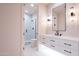 Modern bathroom with sleek floating vanity, framed mirror and glass shower with black hardware at 3153 E Sierra Vista Dr, Phoenix, AZ 85016