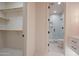 Walk-in closet next to bathroom entrance with glass shower and toilet in modern home design at 3153 E Sierra Vista Dr, Phoenix, AZ 85016