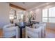 Open-concept dining room with kitchen view, modern table and chairs at 3153 E Sierra Vista Dr, Phoenix, AZ 85016