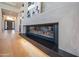 A sleek modern fireplace with a light stone surround and dark accents is in this home at 3153 E Sierra Vista Dr, Phoenix, AZ 85016