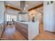 Contemporary kitchen with a large center island, custom cabinetry, and a modern range hood at 3153 E Sierra Vista Dr, Phoenix, AZ 85016