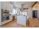 Bright kitchen features white cabinetry, stainless steel appliances, and a stylish center island at 3153 E Sierra Vista Dr, Phoenix, AZ 85016