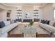 An open-concept living room boasts a cozy fireplace, a large rug, and plenty of natural light at 3153 E Sierra Vista Dr, Phoenix, AZ 85016