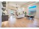 Open concept area with lots of light features a combined living, dining, and entertaining space at 3153 E Sierra Vista Dr, Phoenix, AZ 85016