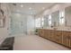 Luxurious main bathroom with dual sinks, soaking tub, and glass shower at 3153 E Sierra Vista Dr, Phoenix, AZ 85016