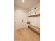Mudroom with bench seating, hooks, shelves and light hardwood flooring, perfect for organization at 3153 E Sierra Vista Dr, Phoenix, AZ 85016