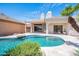 Inviting pool with lush landscaping, covered patio, and desert views, perfect for relaxation and entertaining at 3153 E Sierra Vista Dr, Phoenix, AZ 85016