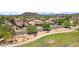 Wide aerial view showcasing the neighborhood with mountain views and green spaces at 35402 N 32Nd Dr, Phoenix, AZ 85086