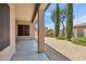 A covered back patio overlooking trees and desert landscaping at 35402 N 32Nd Dr, Phoenix, AZ 85086