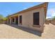 Backyard featuring gravel, desert landscaping, and covered patio at 35402 N 32Nd Dr, Phoenix, AZ 85086