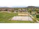 Outdoor basketball court surrounded by green grass and residential neighborhood with mountain views at 35402 N 32Nd Dr, Phoenix, AZ 85086