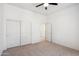 A bedroom with carpet, closet, and open door at 35402 N 32Nd Dr, Phoenix, AZ 85086